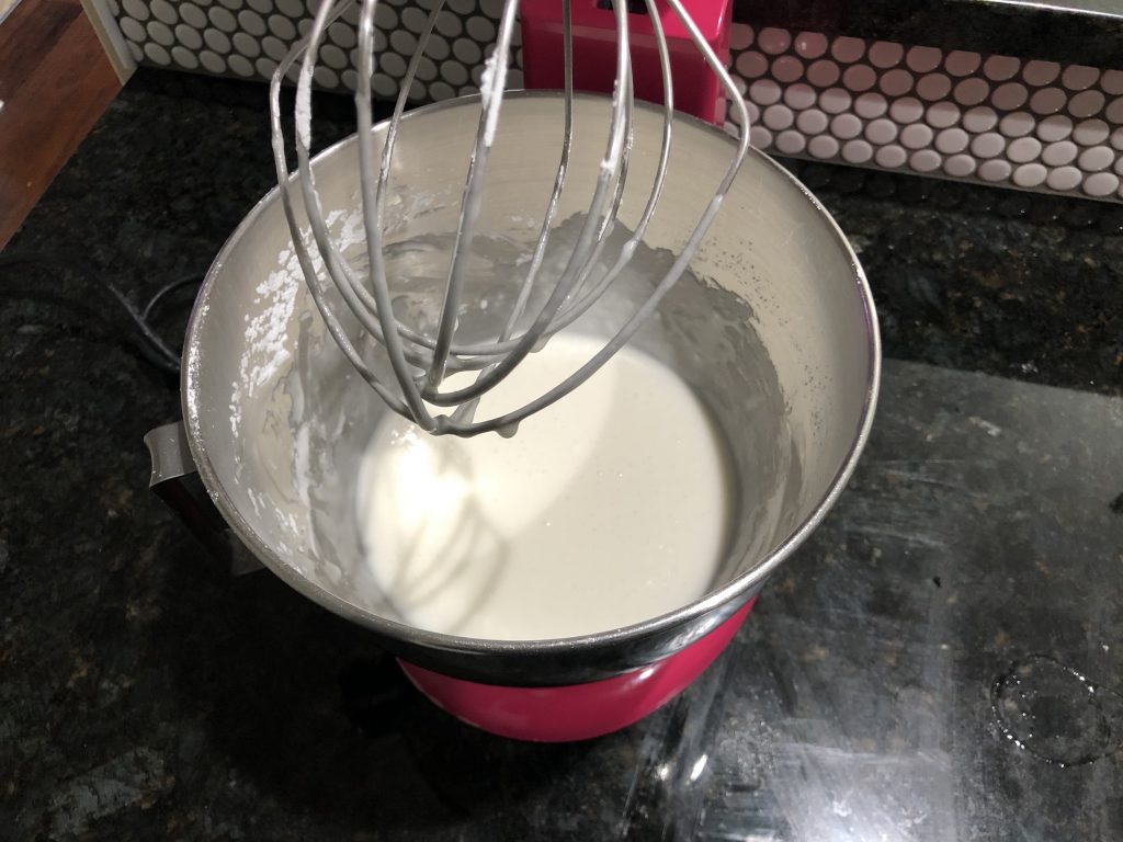 how adding all of the royal icing ingredients to the mixing bowl