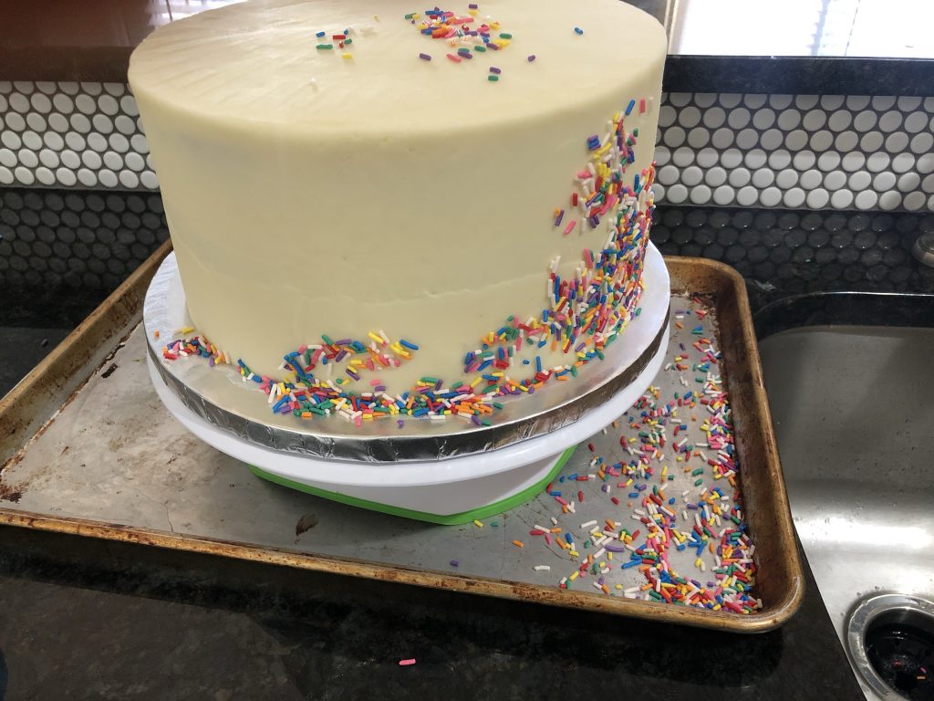 adding sprinkles to cake